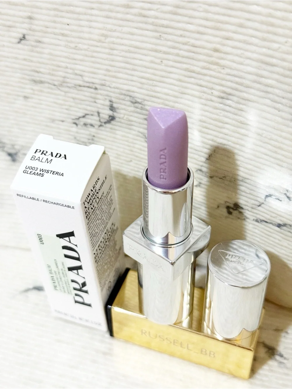 Prada Balm in U003 Wisteria Gleams PH Pinky Lilac Finish with Iridescent Shimmer